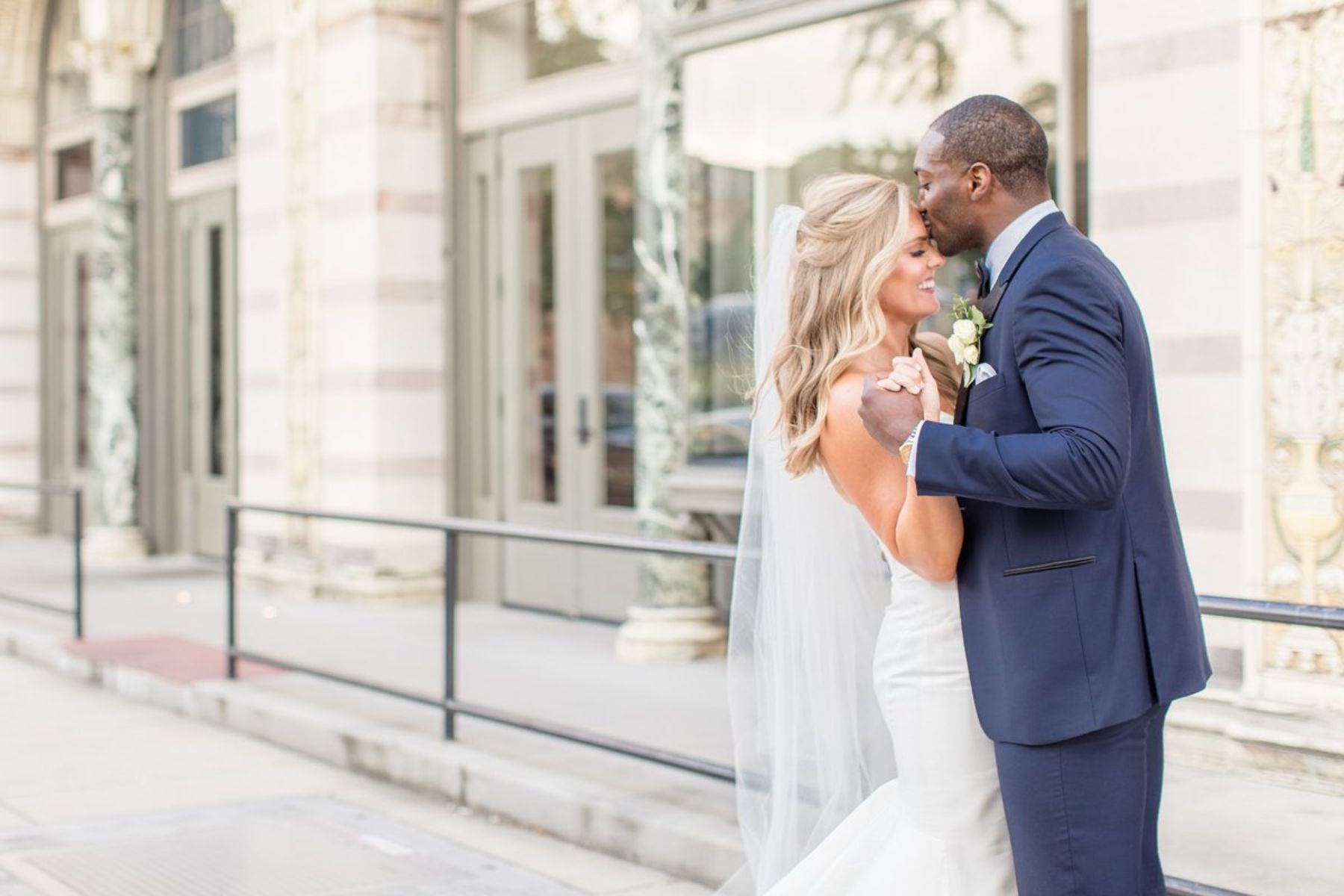 Groom kissing bride