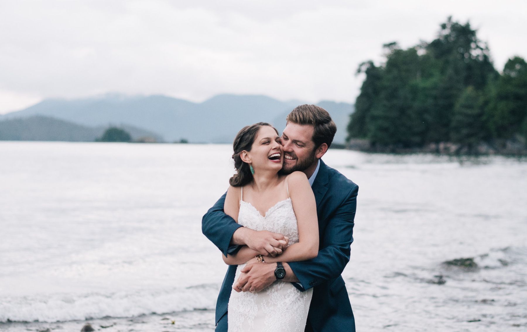 Bride and groom smiling and embracing