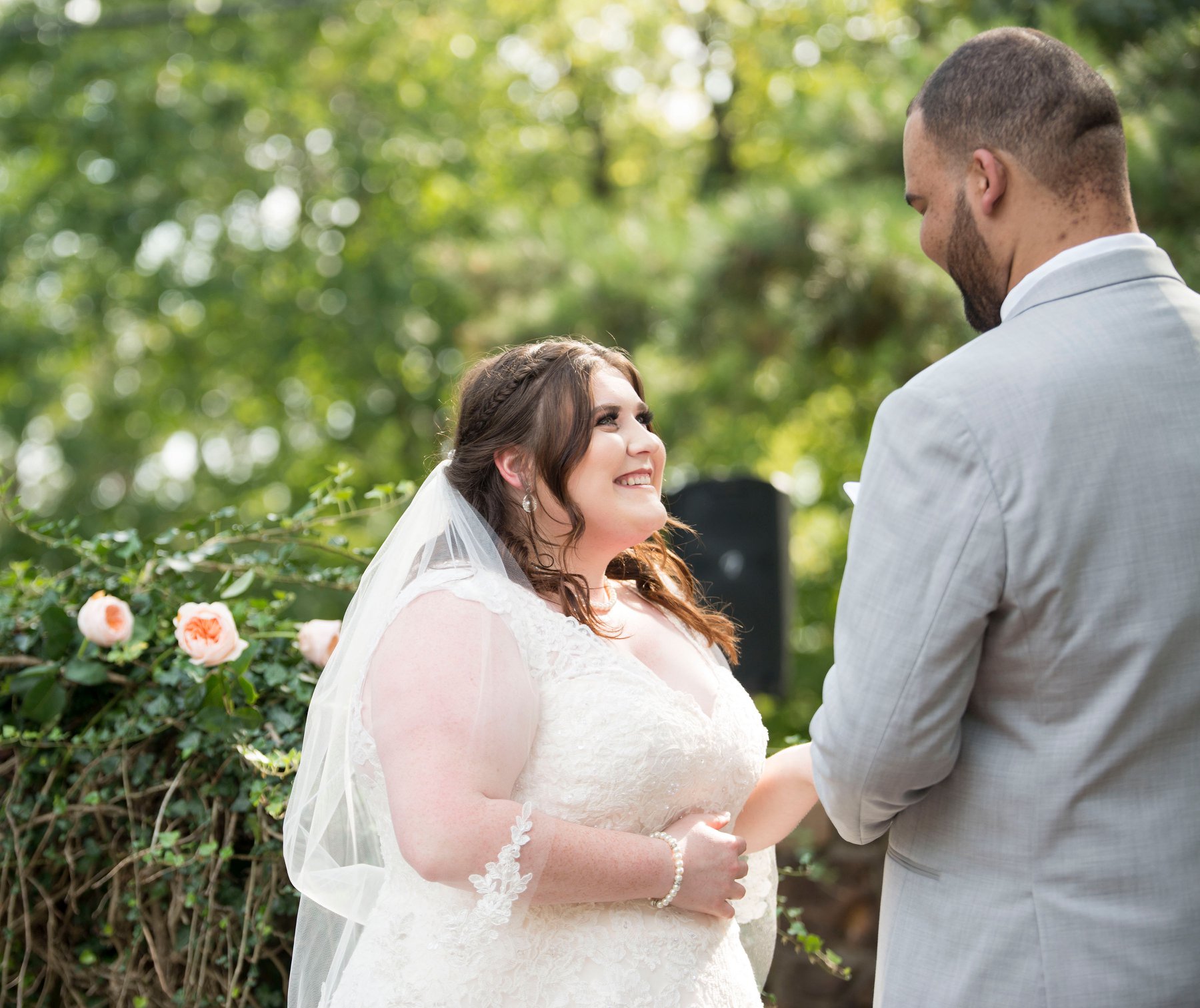 Bride smiling at groom