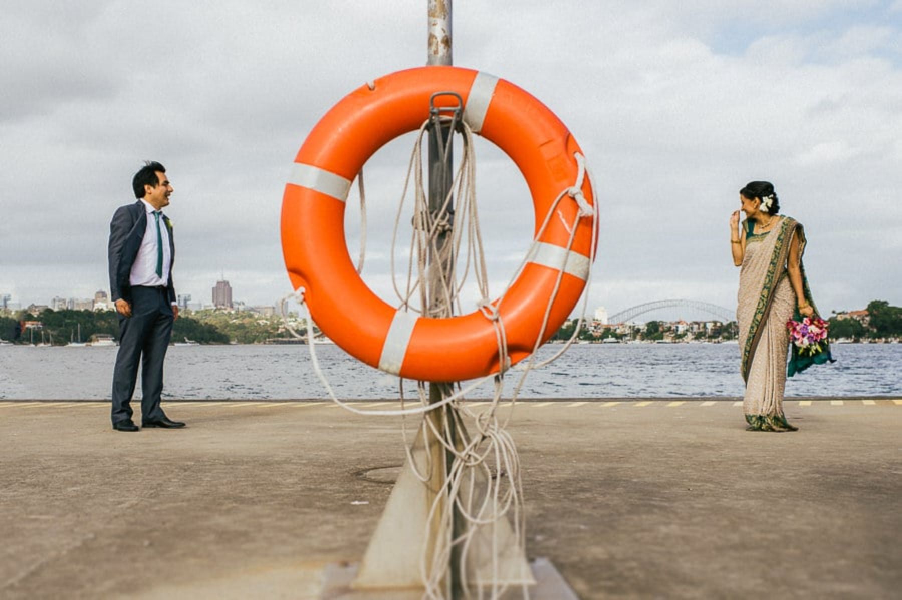 Couple posing on a pier