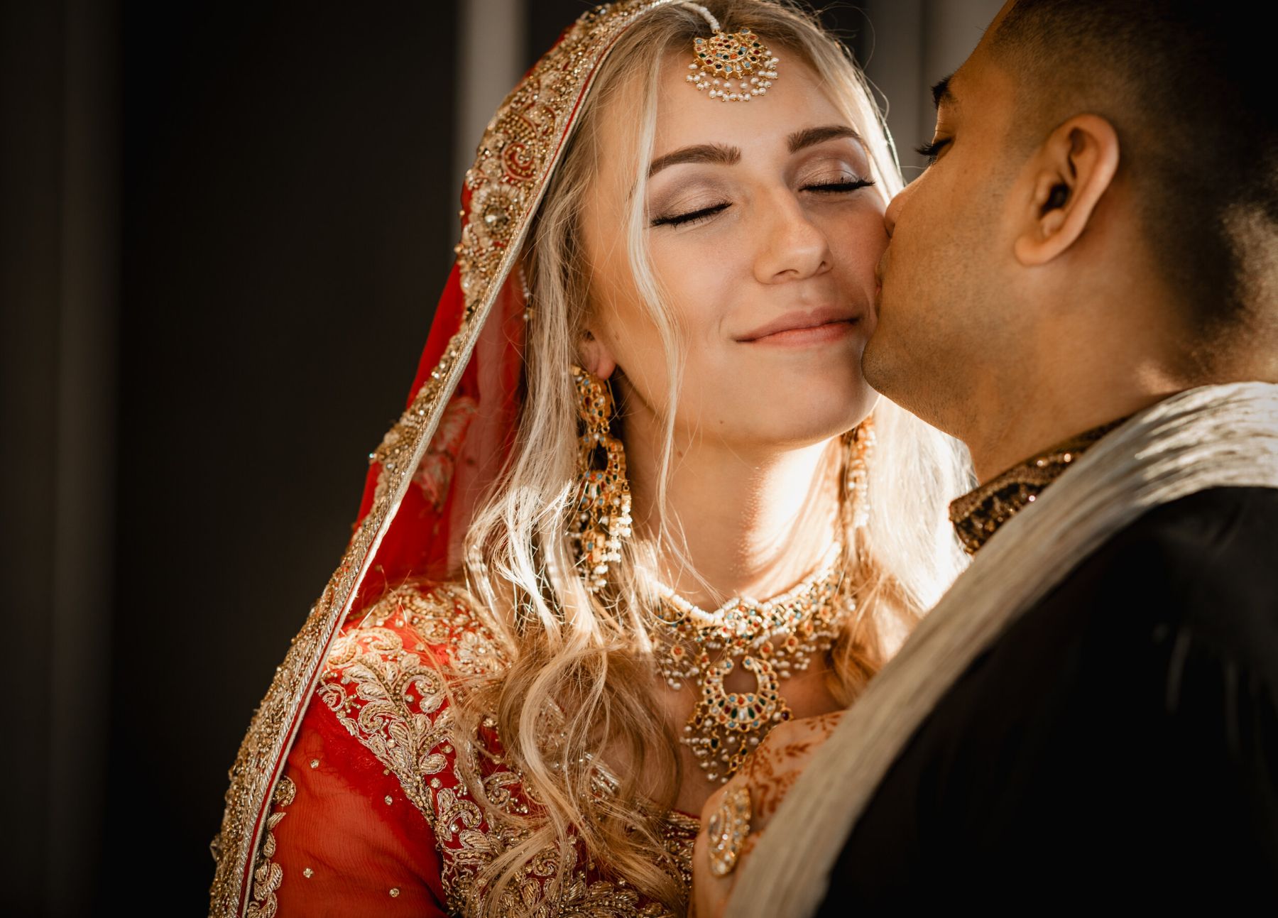 Husband kissing bride