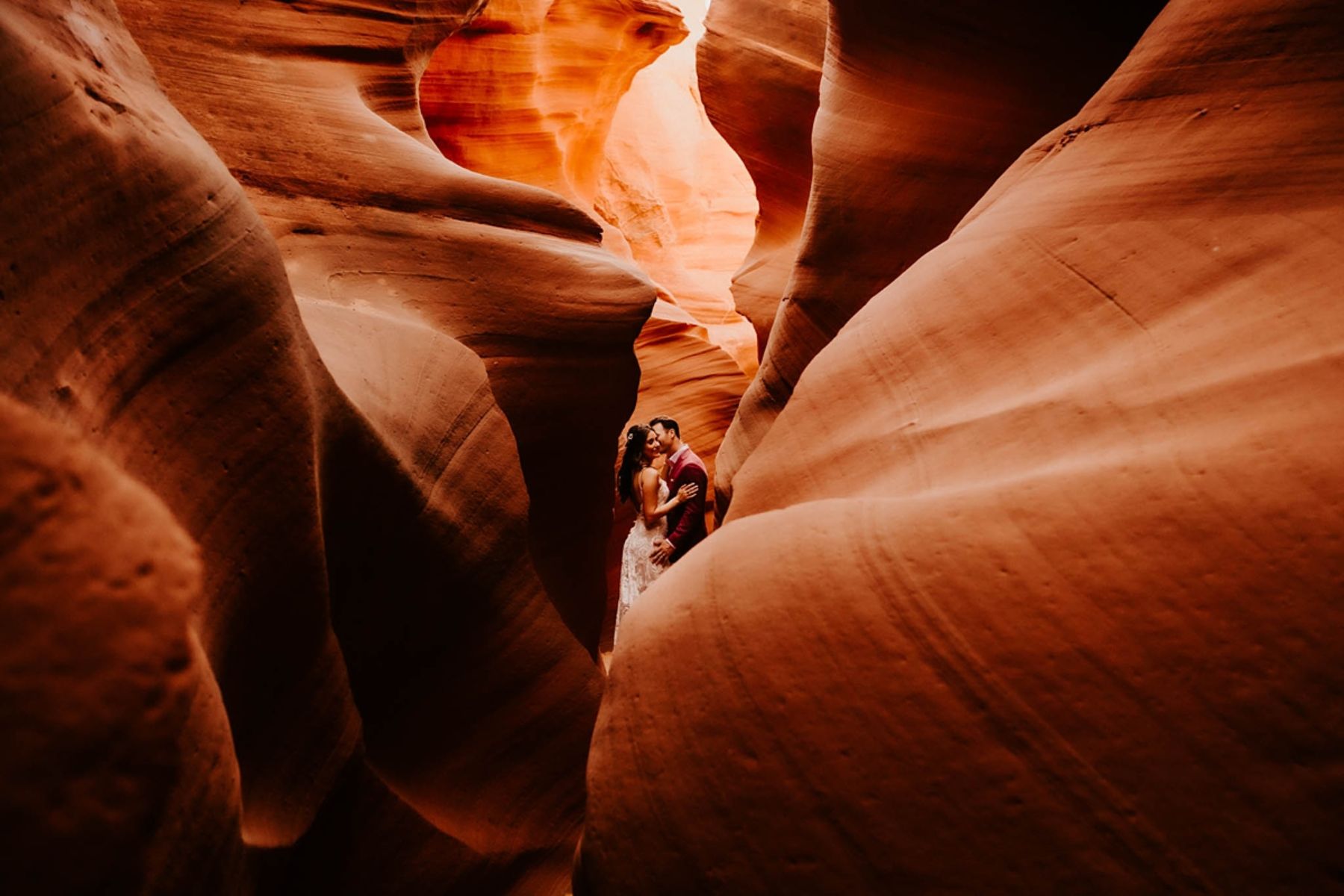 Bride and groom posing in Antelope Canyon, Arizona