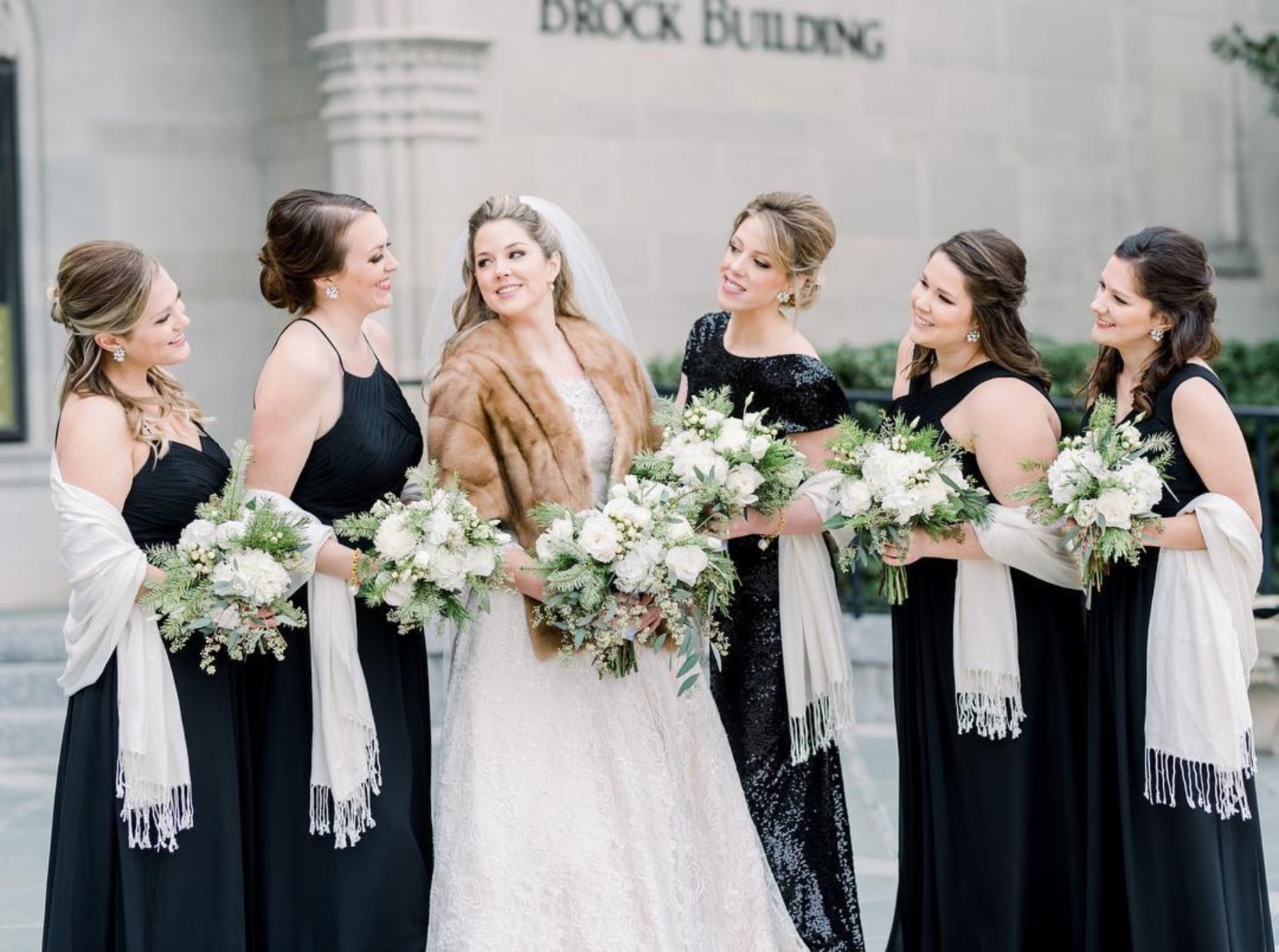 Bride and bridal party holding bouquets