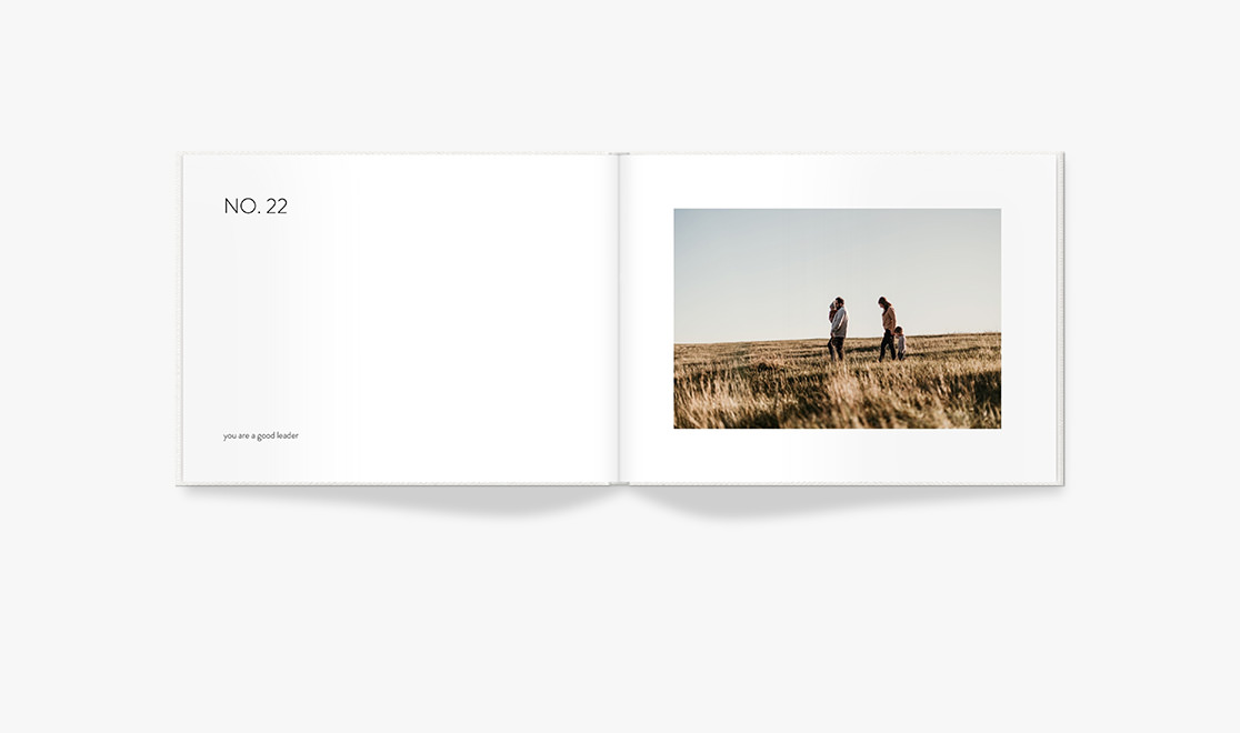 Open Photo Book showing image of family in the grass