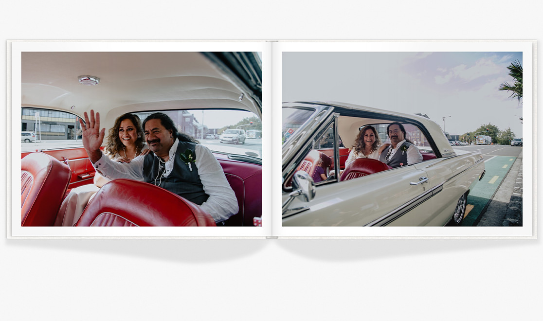 Open photo book with images of a newlywed couple in a classic car on their wedding day.