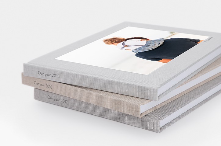 Three Premium Photo Books stacked atop each other.