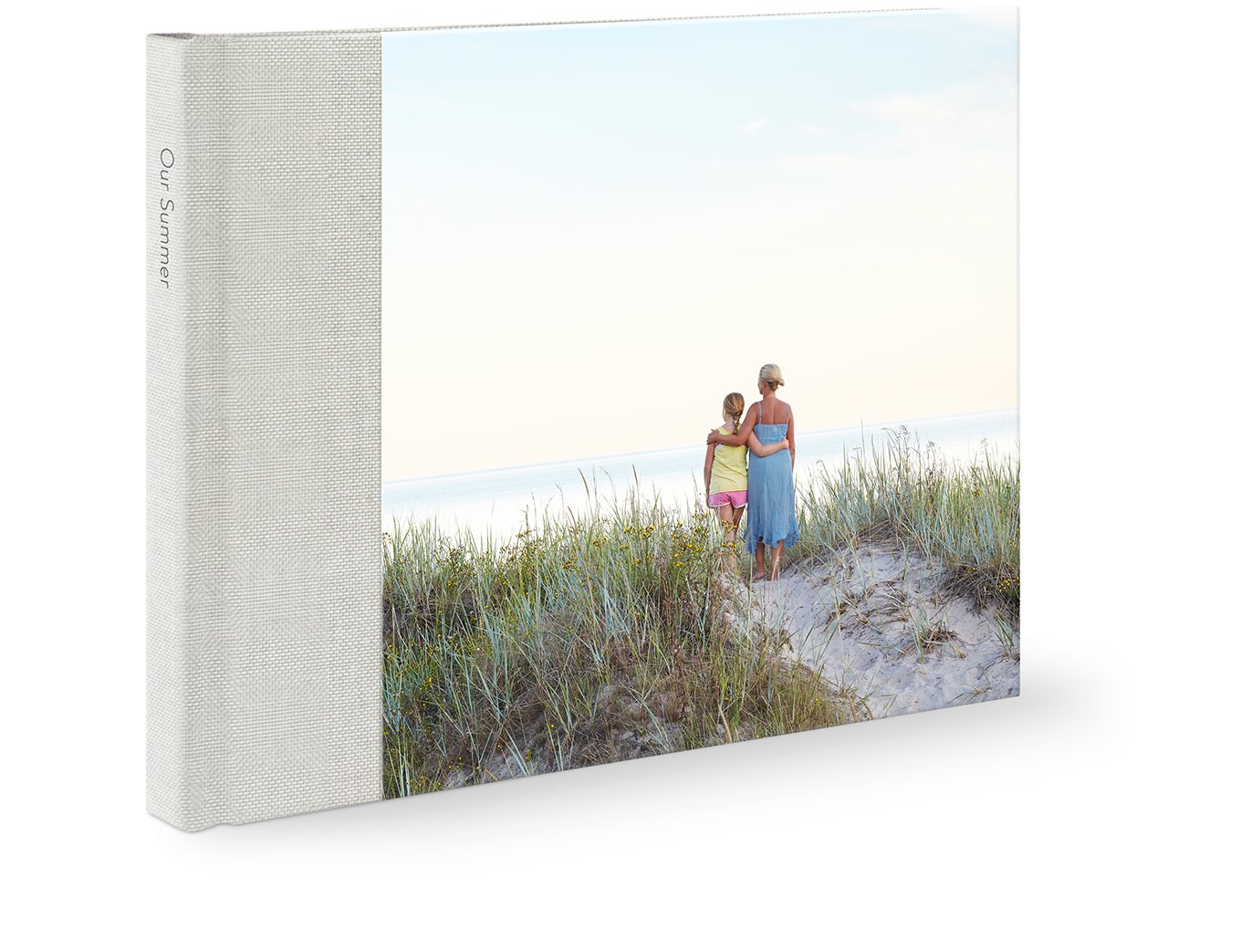 Premium photo book with image of a mother and daughter at the beach on the cover.