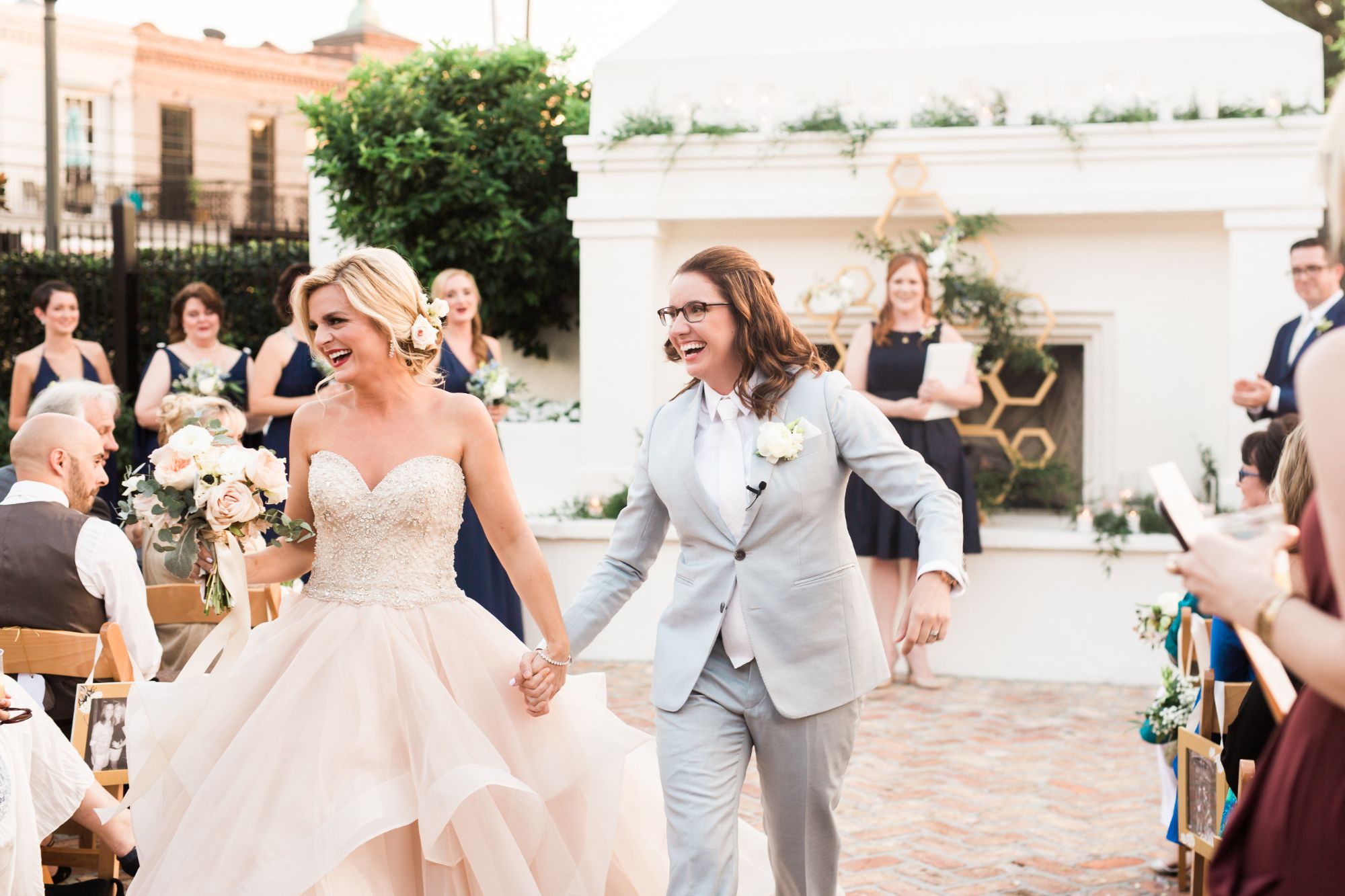 Newlywed couple walking back down aisle.