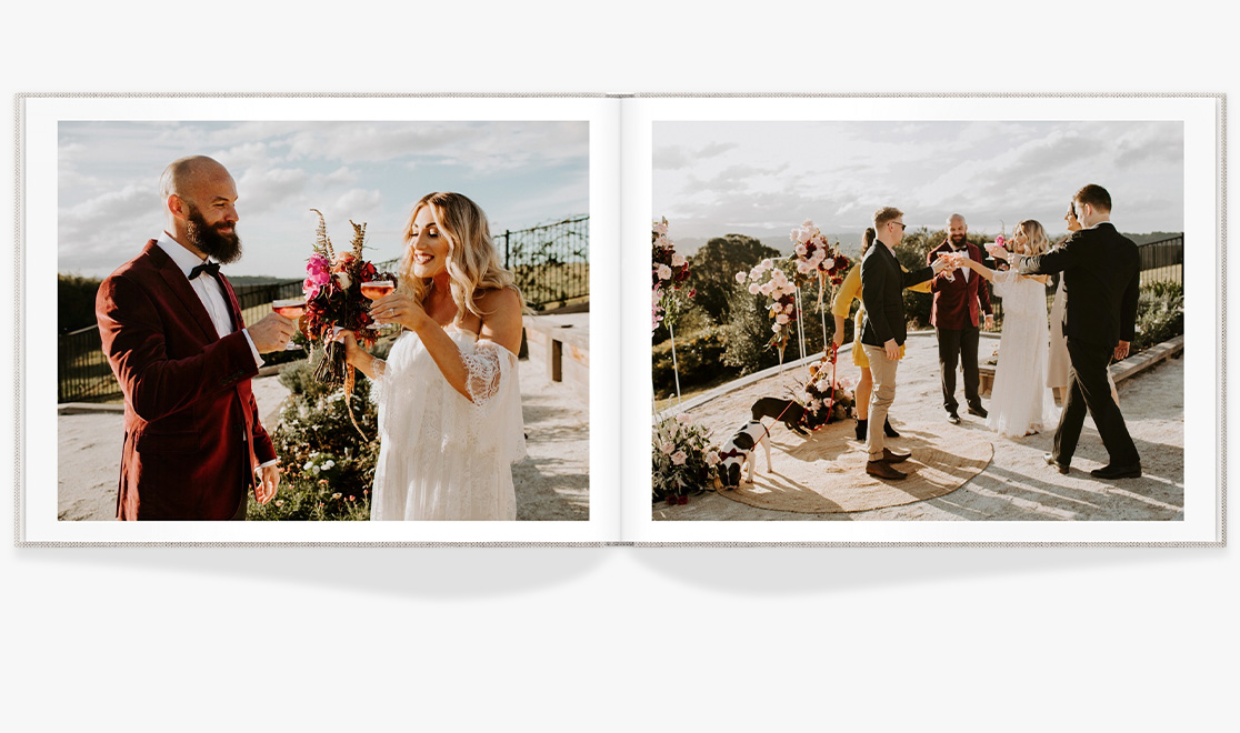 Open Photo Book showing photo of newlyweds toasting their wedding with guests