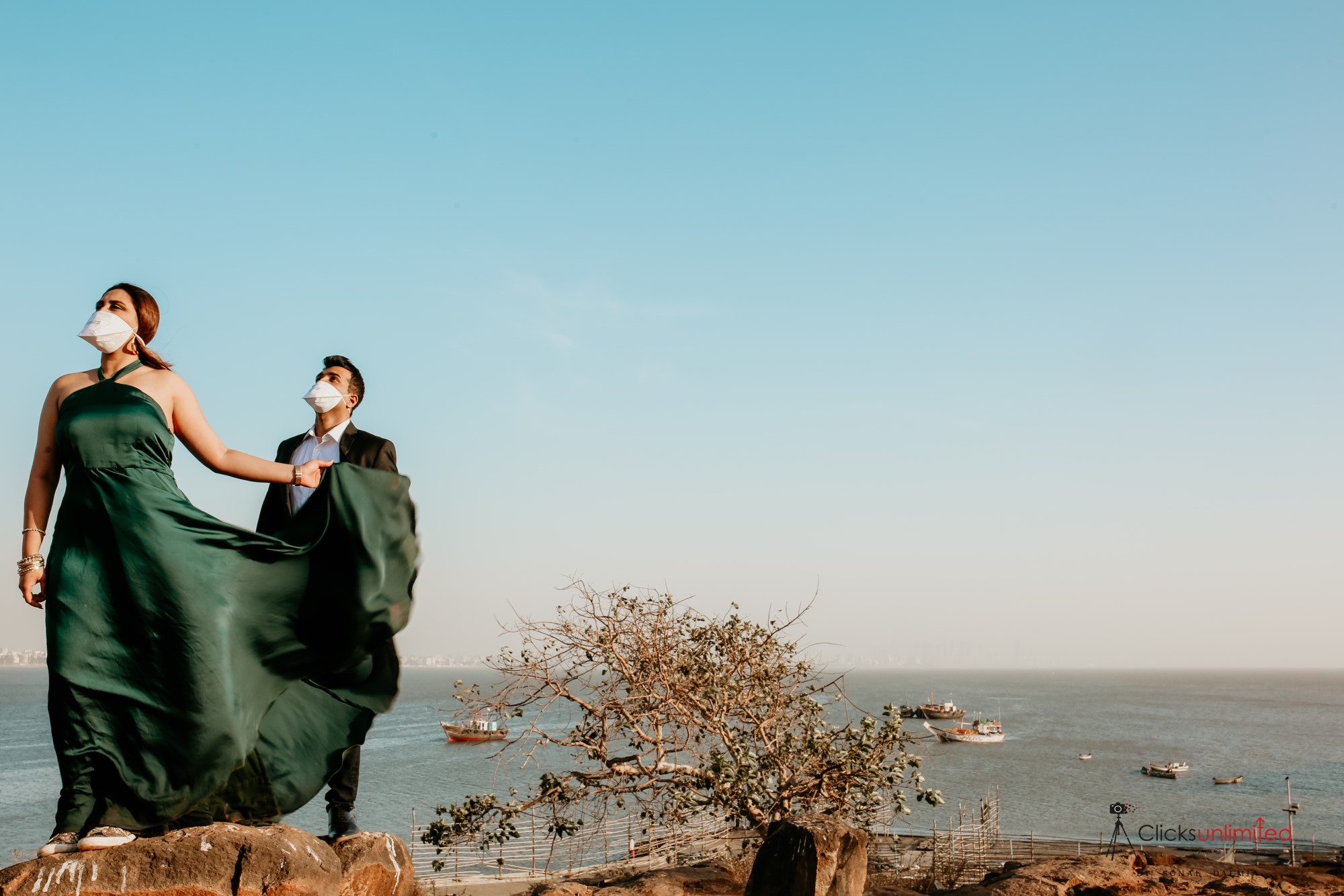 Couple in formalwear wearing masks.