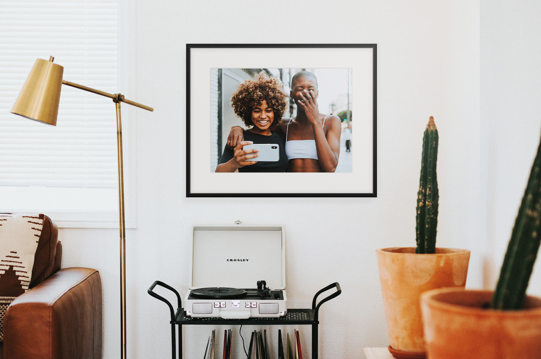 Black Metal Gallery Frame displayed in home showing photo of two friends laughing